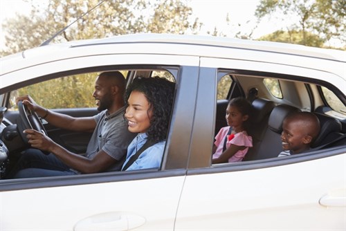 Young Family In Car With Grinding Brakes